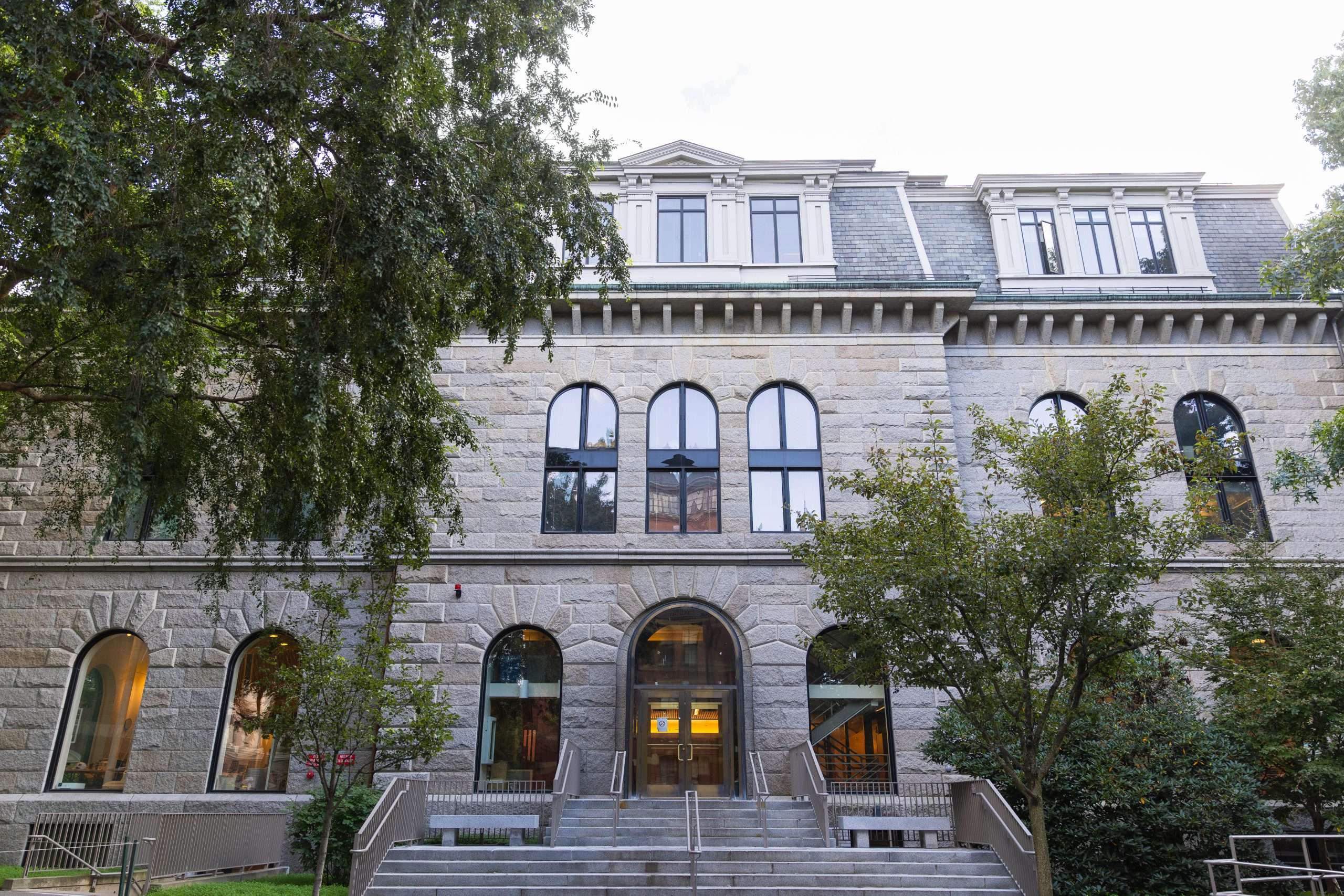 A stone building is featured at Harvard University.