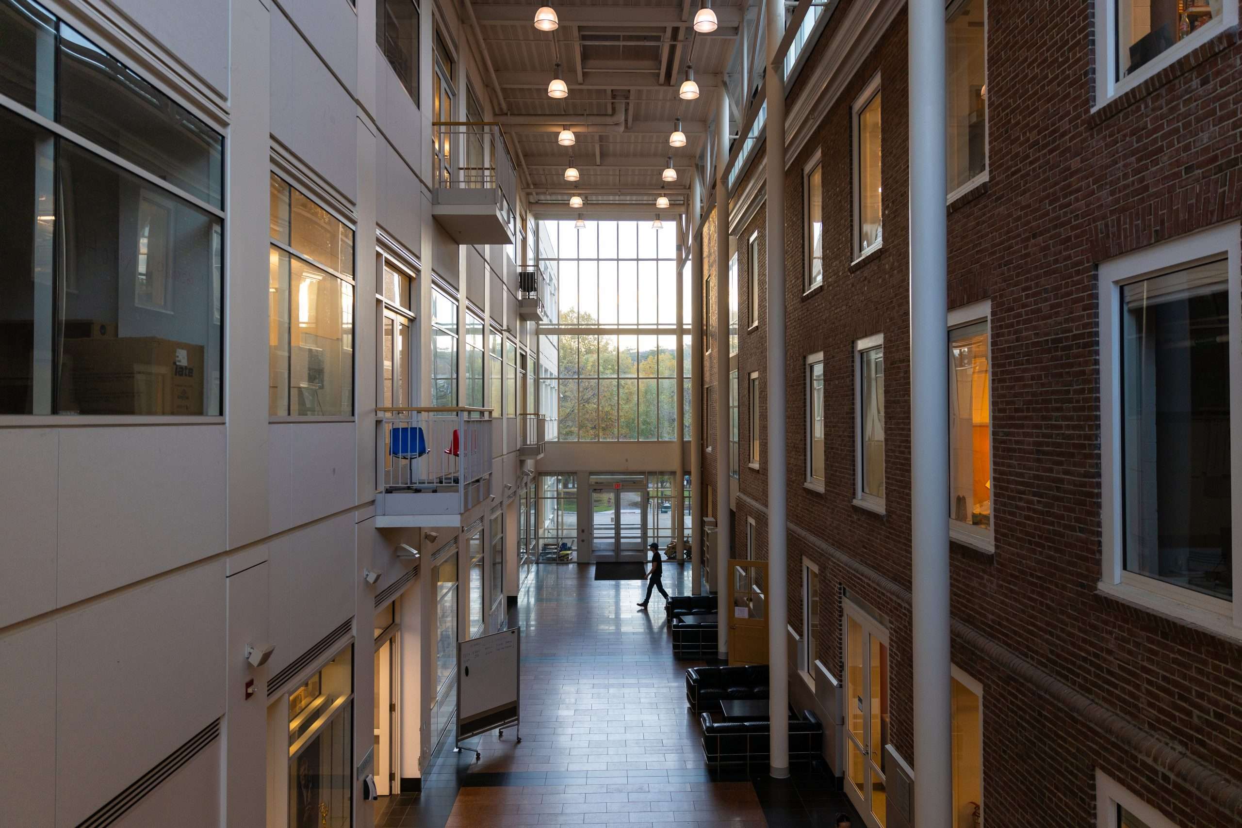 A look inside an interior hallway with a high ceiling that connects two buildings at Dartmouth College.