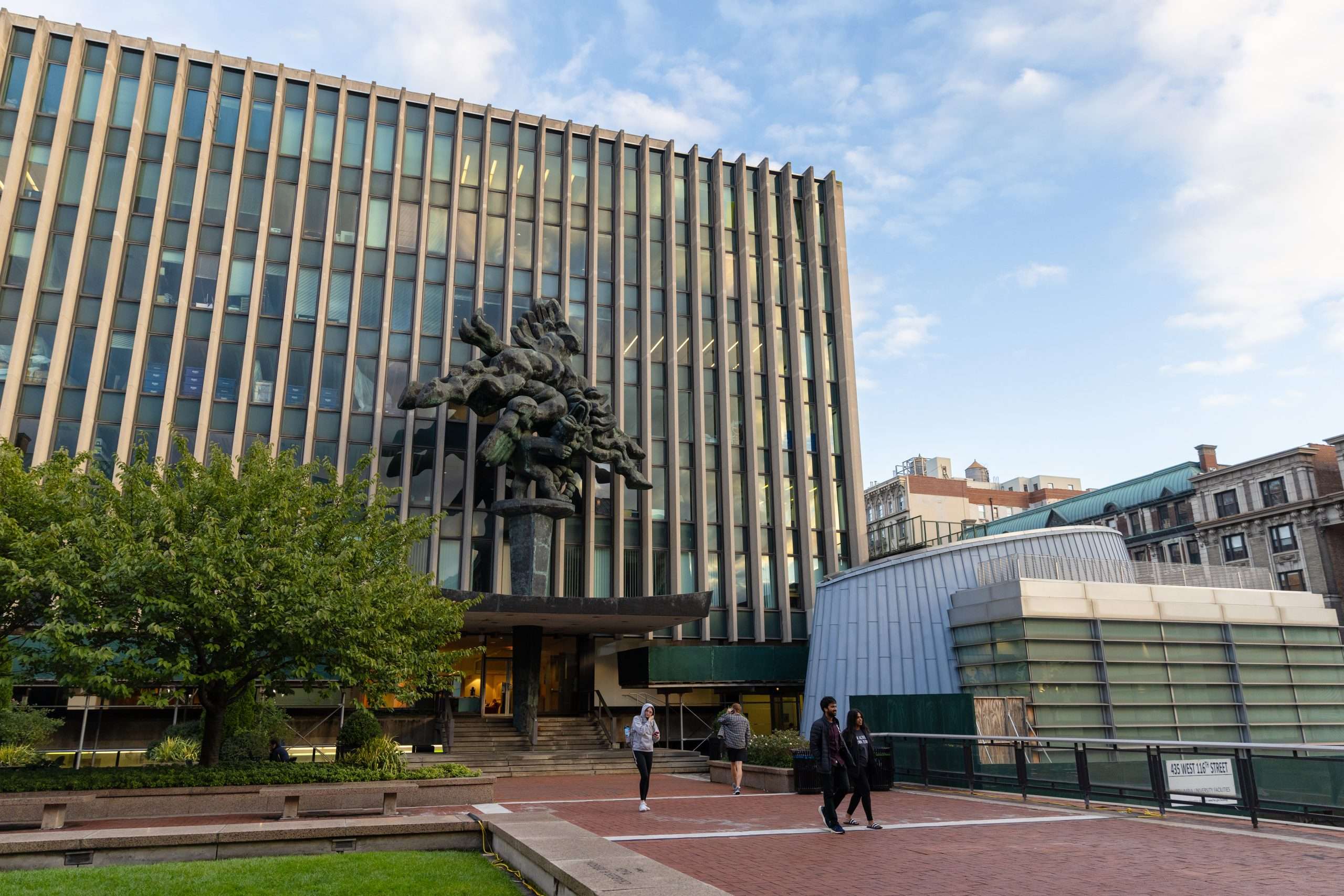 A statue is featured outside a building at Columbia University.