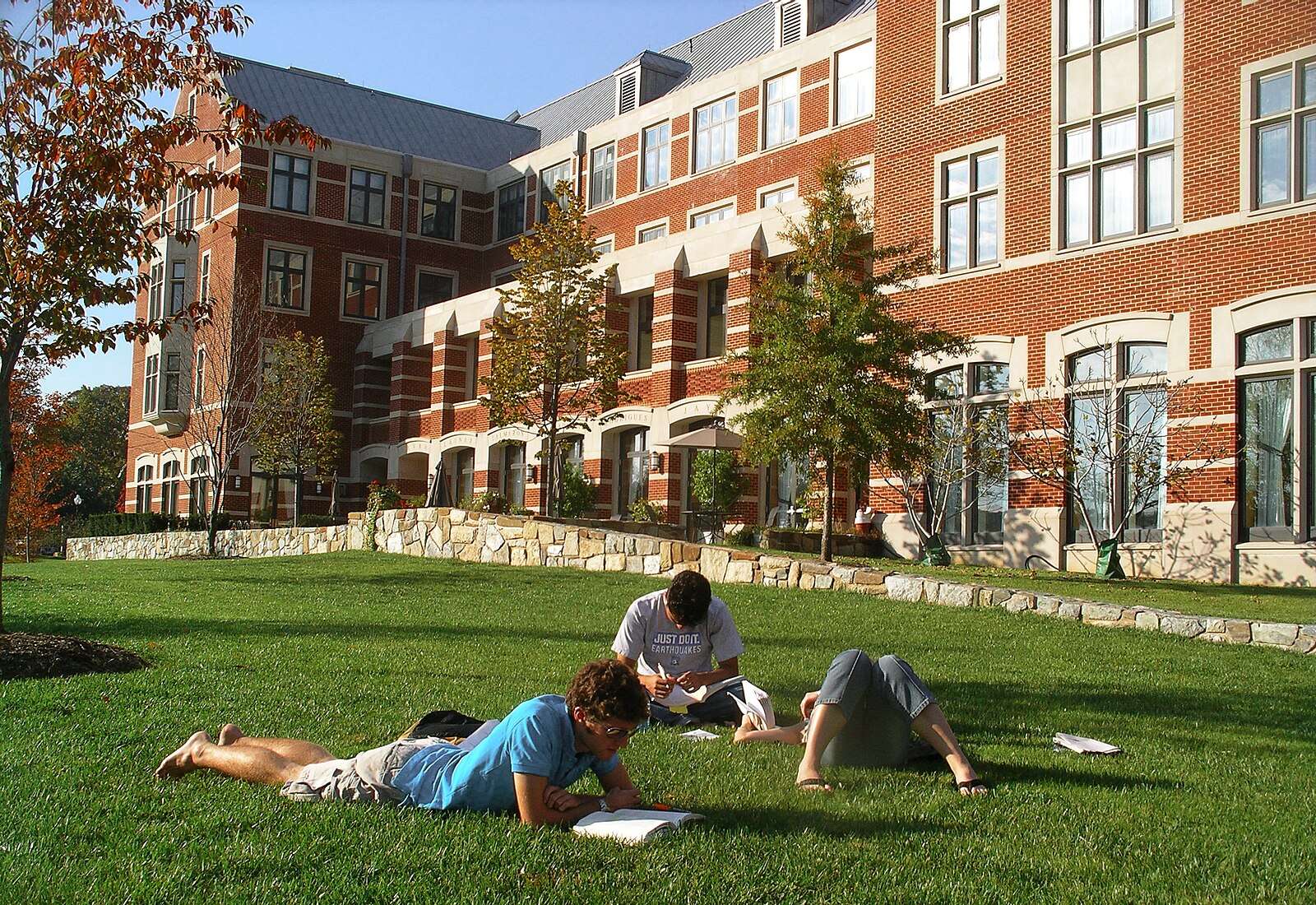 Students study on the lawn outside Wolfington Hall at Georgetown University.