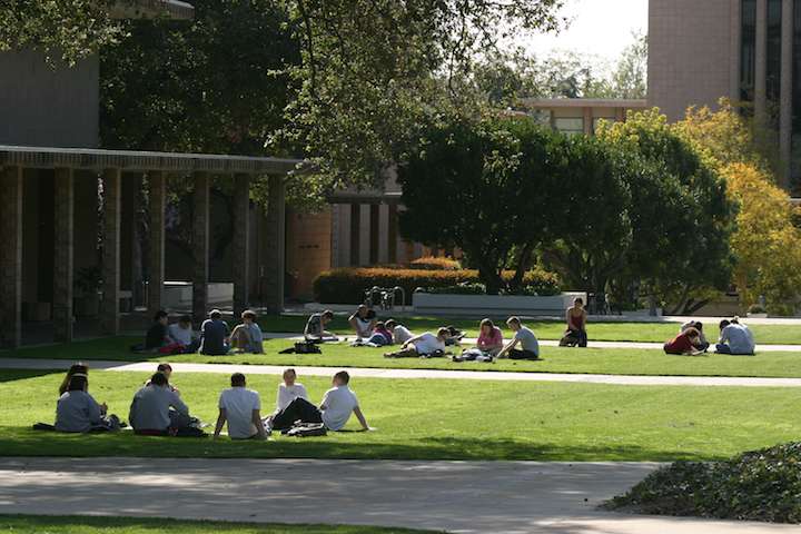 Students learn on a grassy area at Harvey Mudd College.
