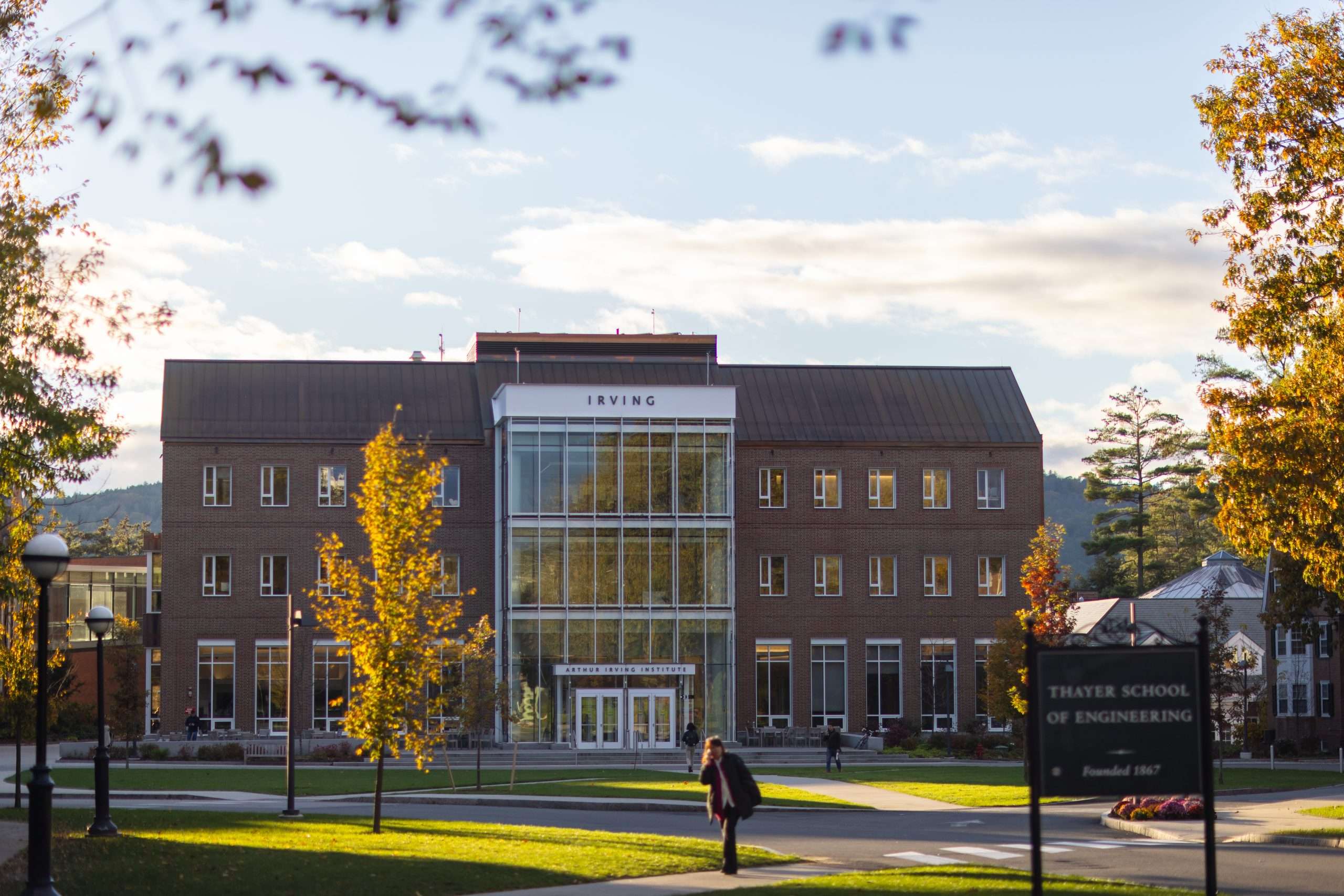 The Thayer School of Engineering's Irving building is visible under a blue sky at Dartmouth College.