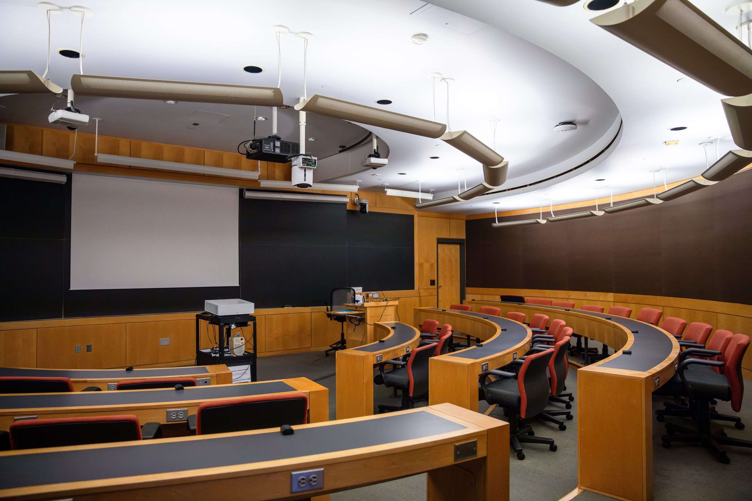 A look inside a Harvard classroom with curved desks.