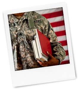 This is a photo of a polaroid of a serviceperson holding books.