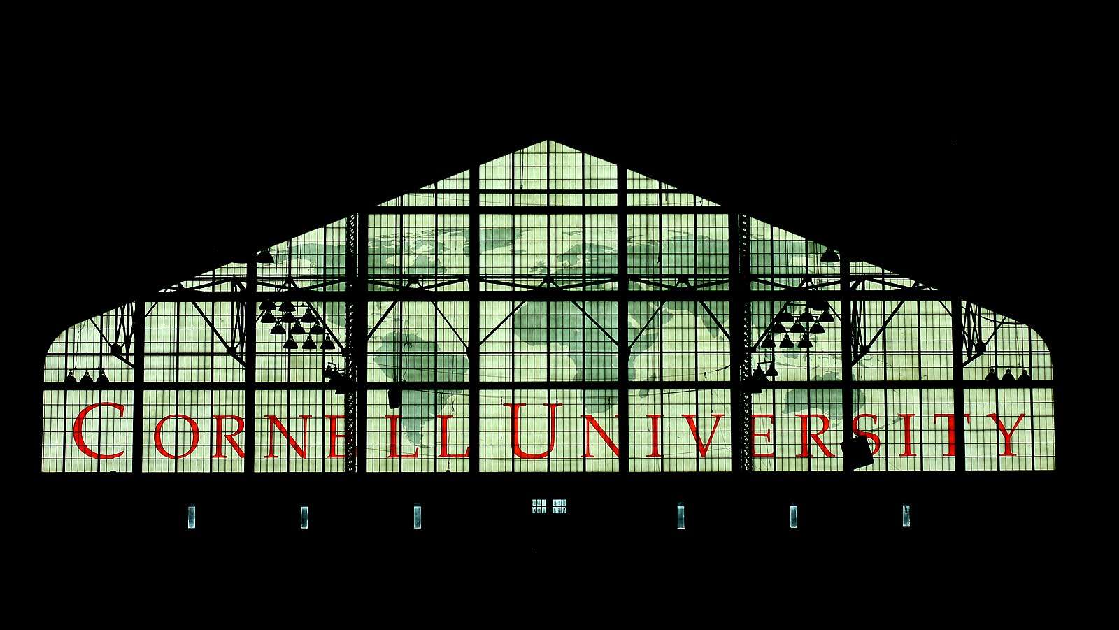 Cornell University's name is featured in red on the windows of Barton Hall.