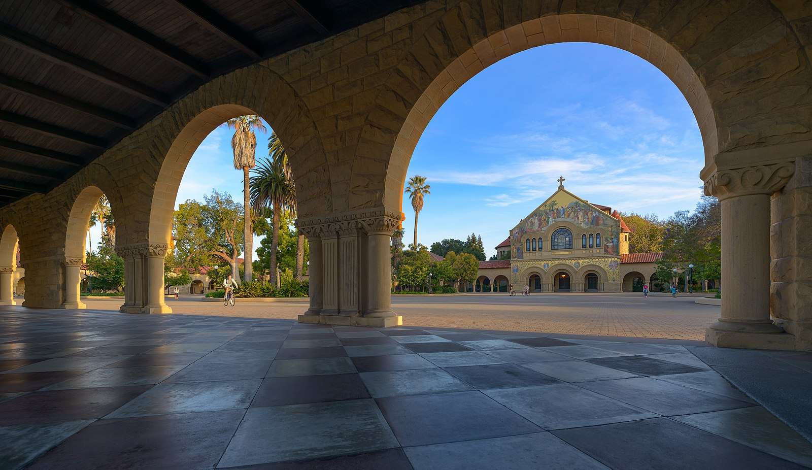 The Stanford University arches are featured with Memorial Church in the background.