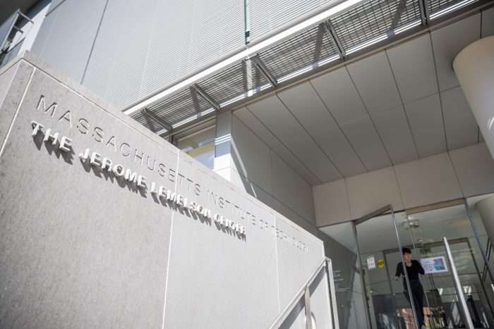 A person walks out of The Jerome Lemelson Center at the Massachusetts Institute of Technology.