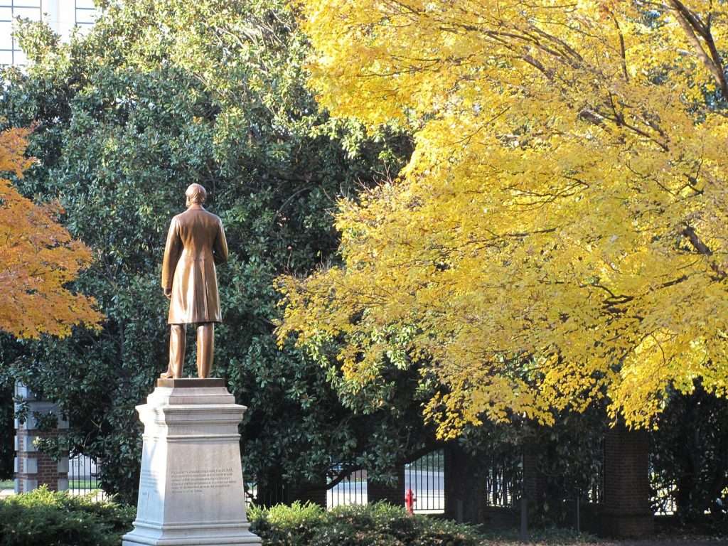 The back of a bronze statue is featured at Vanderbilt University.