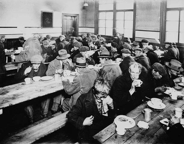 This is a black and white photo of a Depression-era soup kitchen.