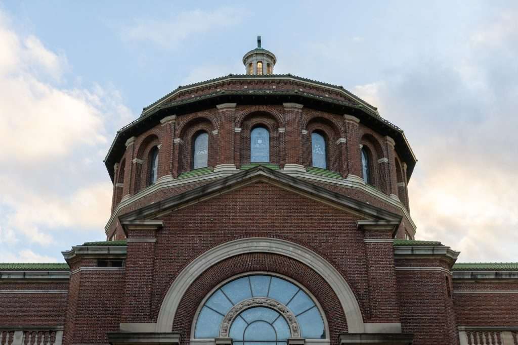 A round steeple of a building is featured at Columbia University.