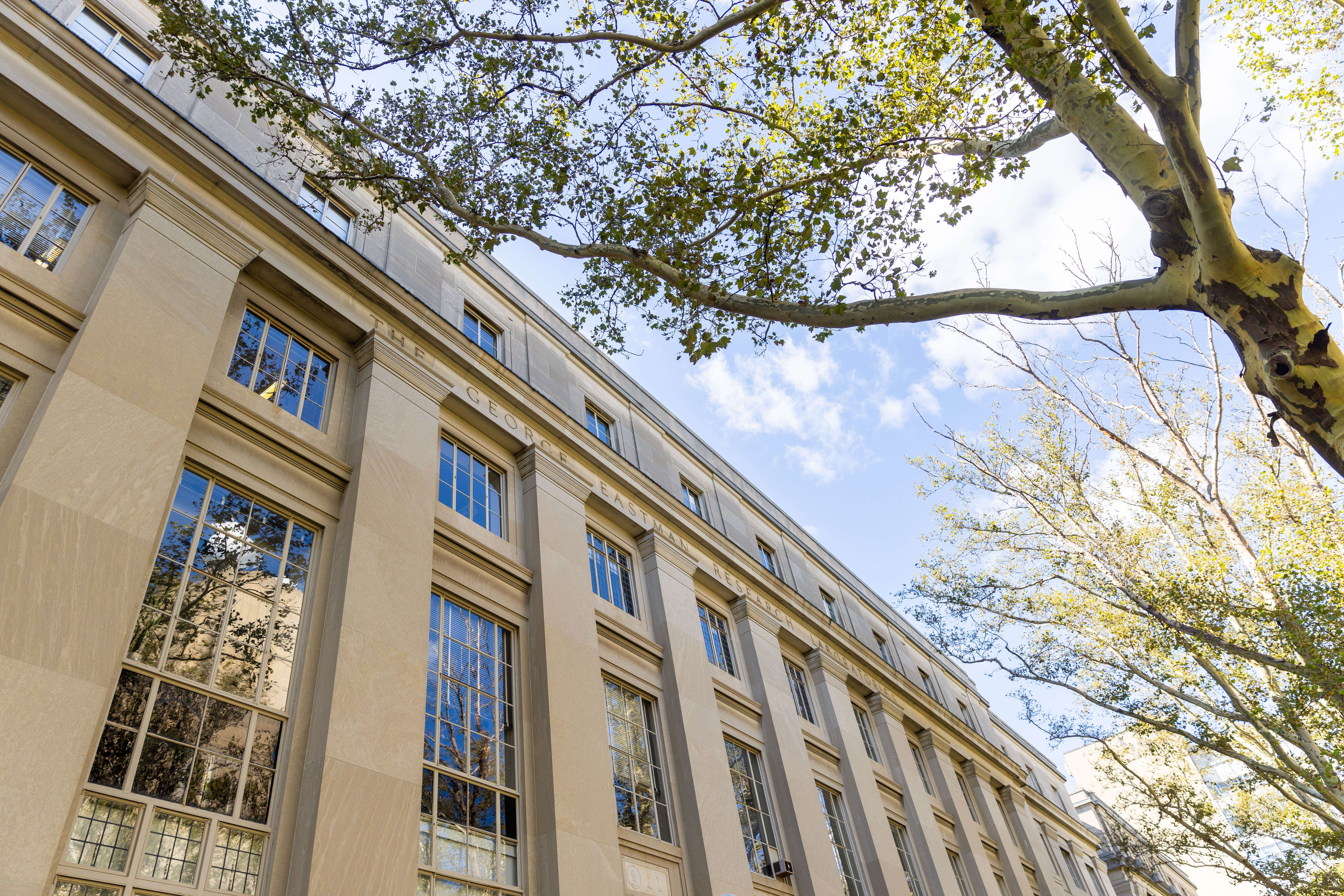 An MIT lecture hall is featured from a low angle during the day time.